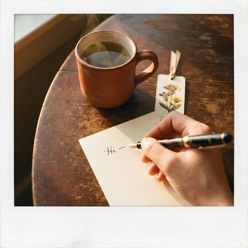 A handwritten thank-you note, ink on cream paper